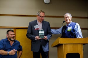 Tom Minty and Barry presenting best practices award to Northwest Multiple Listing Service