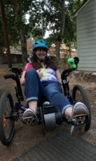 An image of Malinda on her reclined bike.